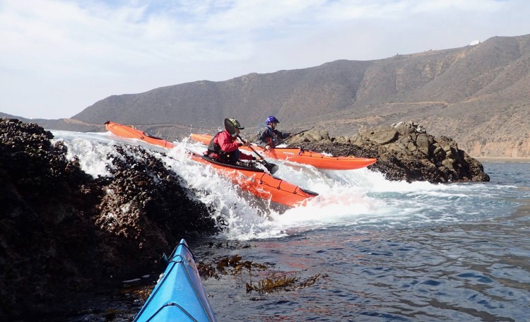 Kayak going over rock ledges in Baja, Mexico